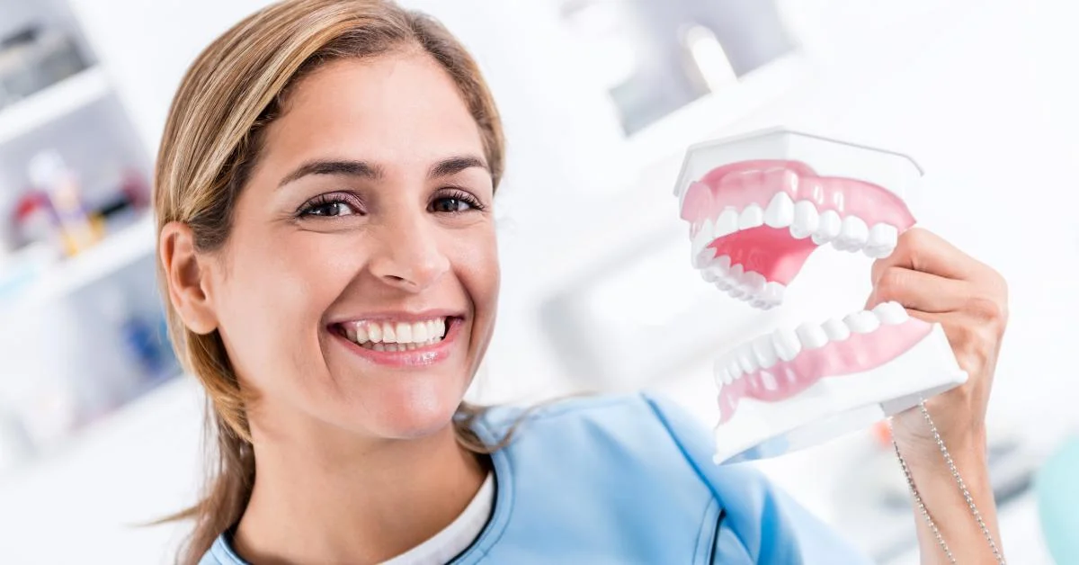Elderly woman cleaning dentures